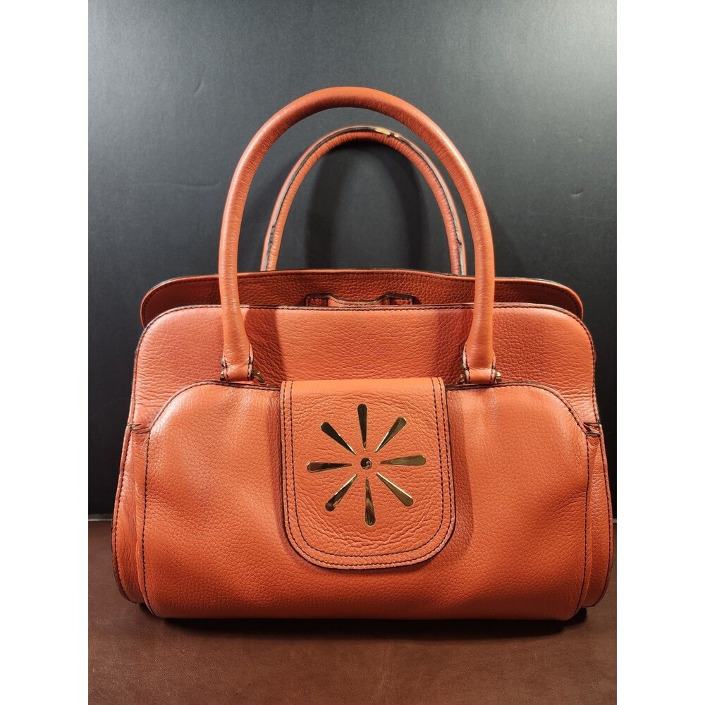orange pebbled leather top-handle satchel bag by Isaac Mizrahi.